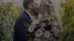 bride and groom kissing in the tre posti vineyard